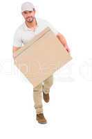 Delivery man with cardboard box running