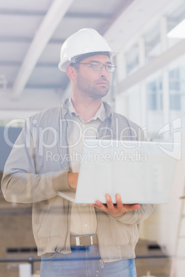 Architect using laptop in office