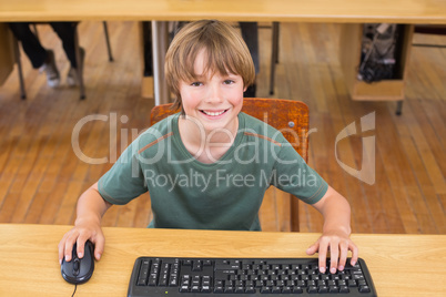 Cute pupil in computer class