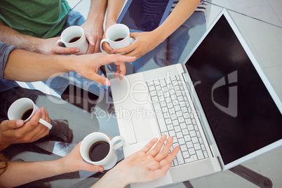 Fashion students holding cup of coffee