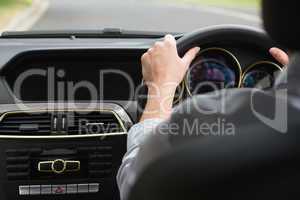 Businesswoman sitting in drivers seat