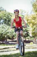 Fit woman riding her bicycle