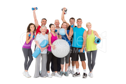 Cheerful people holding exercise equipment