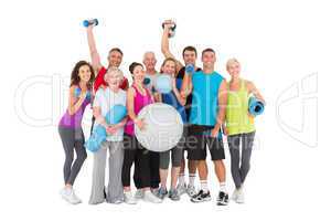 Cheerful people holding exercise equipment