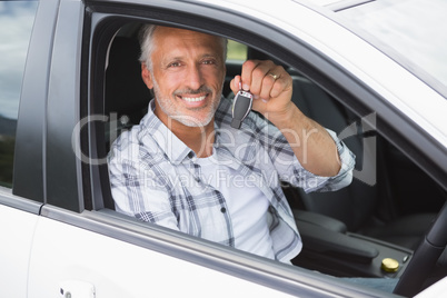 Man smiling and holding key