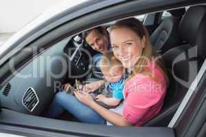 Parents and baby on a drive