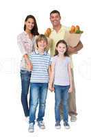 Happy family with grocery bags