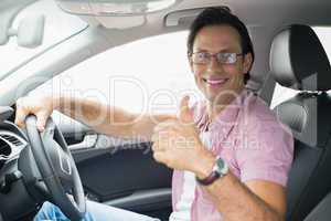 Man smiling while driving
