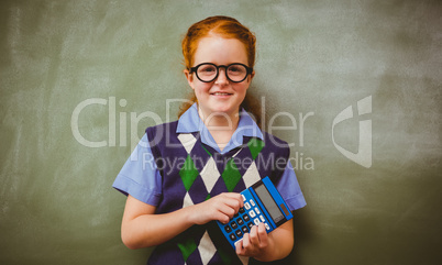 Portrait of cute little girl holding calculator