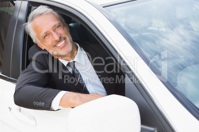 Businessman sitting in drivers seat