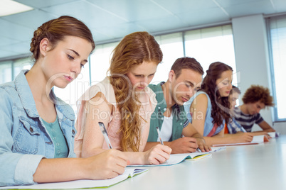 Fashion students taking notes in class