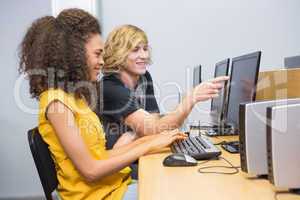 Students working on computer in classroom