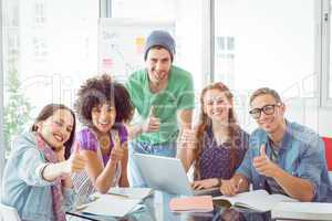 Fashion students smiling at camera together