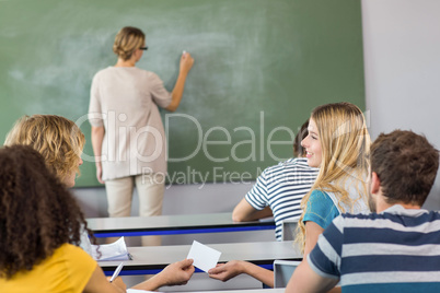 Teacher teaching students in class