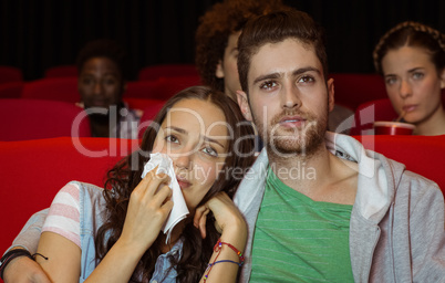 Young couple watching a film