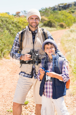 Father and son hiking in the mountains