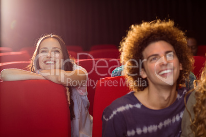 Young friends watching a film