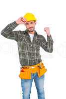 Smiling manual worker clenching fist
