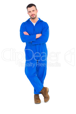 Mechanic standing arms crossed on white background Mechanic standing arms crossed on white background