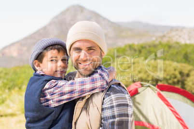 Father and son by their tent