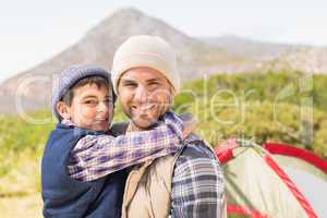 Father and son by their tent