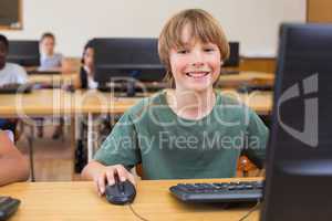 Cute pupil in computer class