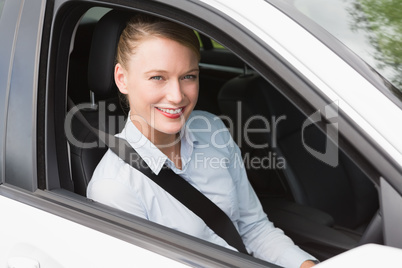 Happy businesswoman in the drivers seat