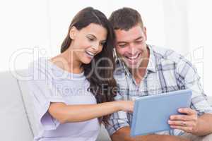 Couple using tablet PC together