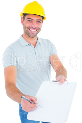 Smiling manual worker giving clipboard for signature