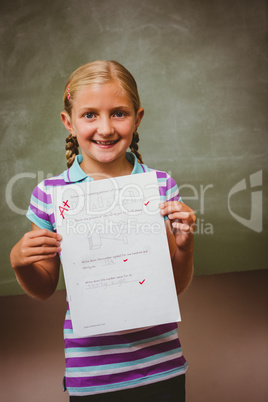 Portrait of cute little girl holding paper