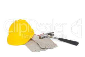 Gloves with hammer and hardhat on white background