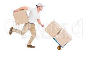 Delivery man with trolley of boxes running