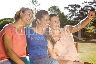 Students taking selfie outside on campus