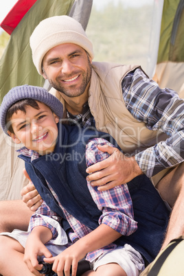 Father and son in their tent