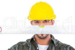 Handyman looking at spirit level