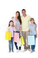 Happy family carrying shopping bags