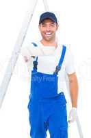 Handyman using paint roller on white background