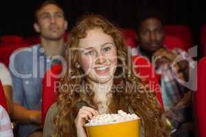 Young friends watching a film