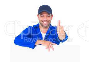 Mechanic with blank placard gesturing thumbs up