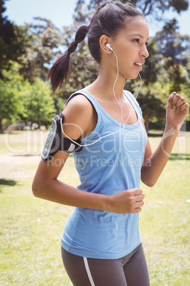 Fit woman jogging in the park