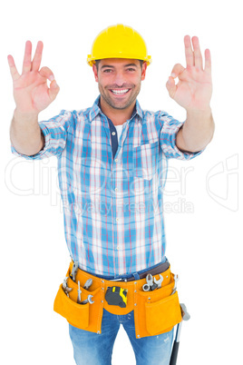 Smiling handyman gesturing okay