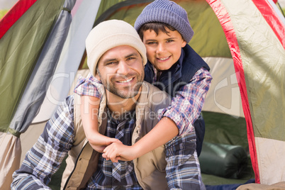 Father and son in their tent Father and son in their tent