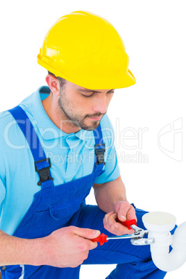 Handyman holding pliers