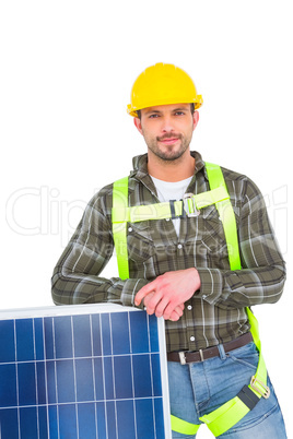 Happy handyman with solar panel