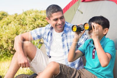 Father and son beside their tent