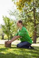 Environmental activist about to plant tree