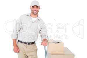 Confident delivery man with cardboard boxes