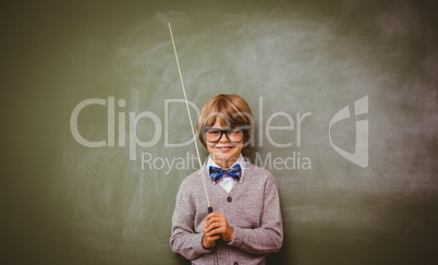 Portrait of cute little boy holding stick