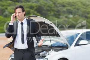 Businessman after a car breakdown