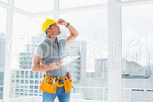 Handyman inspecting building